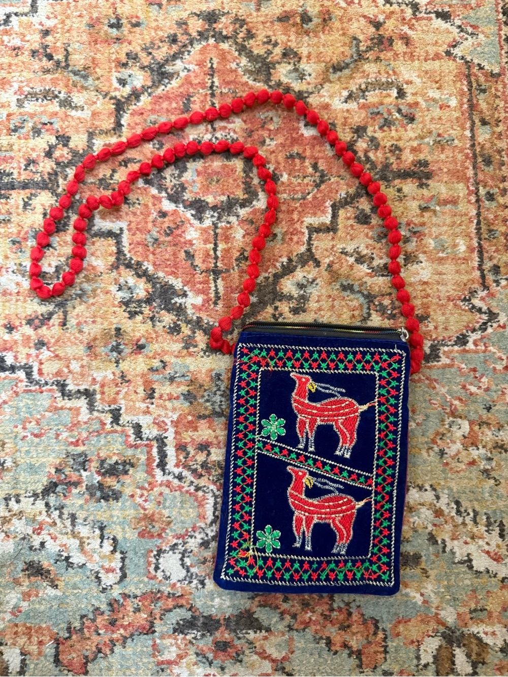 Hand Embroidered Navy Crossbody Bag with Red Pom-Pom Strap